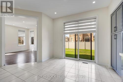 Eating Area into Family Room - 93 Parity Road, Brampton, ON 