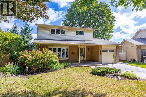Two-story facade with light-colored siding and brick accents - 3148 Terraview Court, Burlington, ON 
