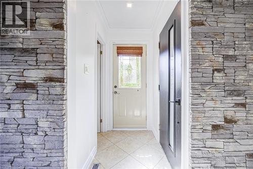 Stone veneer wall accents with crown molding detail - 3148 Terraview Court, Burlington, ON 