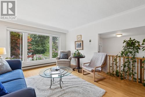 Bright living room with large window - 128 Holmcrest Trail, Toronto, ON 