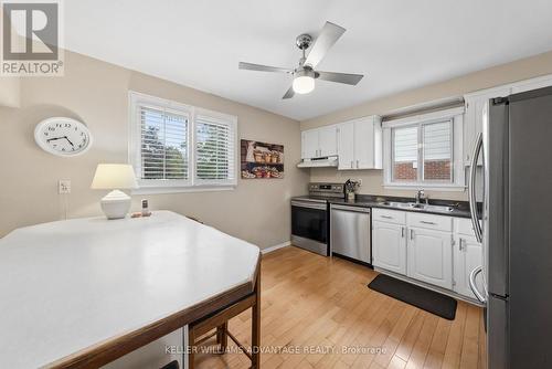 Kitchen with stainless steel appliances - 128 Holmcrest Trail, Toronto, ON 