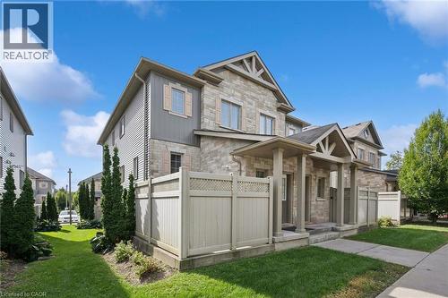 Stone veneer and siding exterior with gabled roof accents - 931 Glasgow Street Unit# 27B, Kitchener, ON 