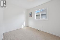 Bright white walls with light-toned carpeting - 