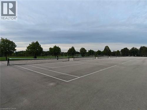 Paved multi-court sports area with multiple nets and surrounding green space - 931 Glasgow Street Unit# 27B, Kitchener, ON 