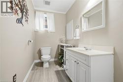 White vanity with dual cabinet doors and an integrated sink - 