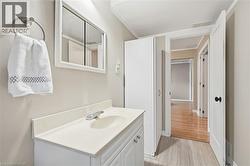 Vanity with integrated sink, framed mirror, and chrome faucet - 