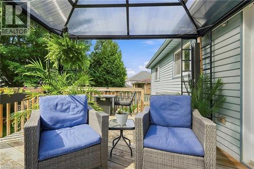 Wood-finish deck with a translucent covered patio structure - 94 Kent Road, Brantford, ON 