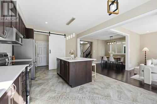 24'x24' diamond-laid floor tiles paired barn door - 55 Solaris Drive, Ottawa, ON 