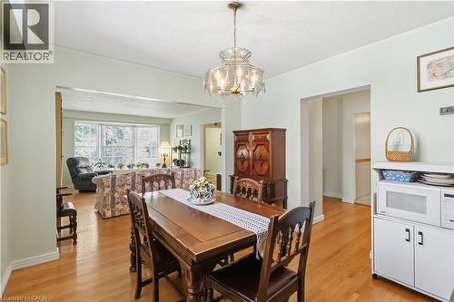 Hardwood flooring throughout, recessed lighting, and a bay window in the living area - 152 Hilda Avenue, North York, ON 