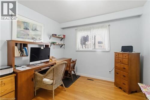 Light-toned walls, wood-finish flooring, and a large window providing natural light - 152 Hilda Avenue, North York, ON 