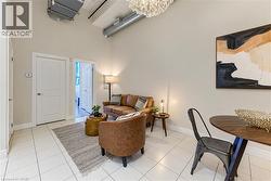 Tile flooring, high ceilings, exposed ductwork, built-in lighting, and interior doors - 