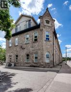 Stone facade architecture with a gabled dormer and balcony - 
