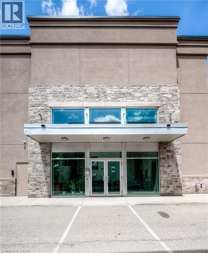 Stone facade with a modern awning - 25 Concession Street Unit# 110, Cambridge, ON 