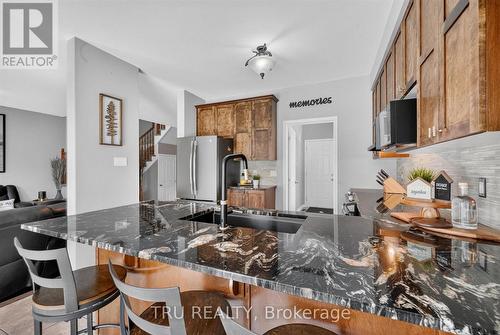 kitchen with new granite counter, and more - 325 Upcountry Drive E, Ottawa, ON 