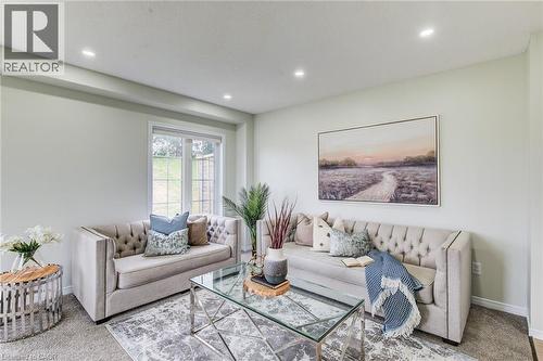 Recessed ceiling lighting, light-colored walls, window with gridded pane, and carpeted flooring - 226 Maitland Street, Kitchener, ON 