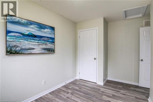 Wood-finish flooring with white trim and paneled doors - 226 Maitland Street, Kitchener, ON 