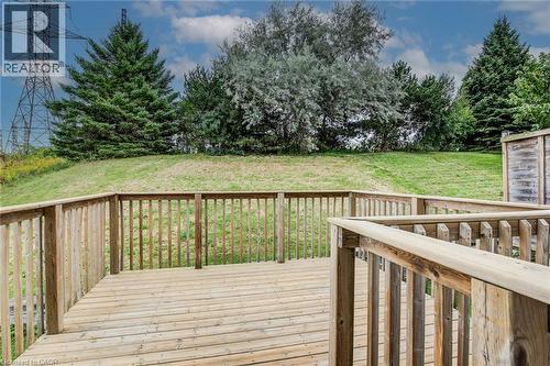 Wood-finish deck with railing overlooking a grassy expanse - 226 Maitland Street, Kitchener, ON 