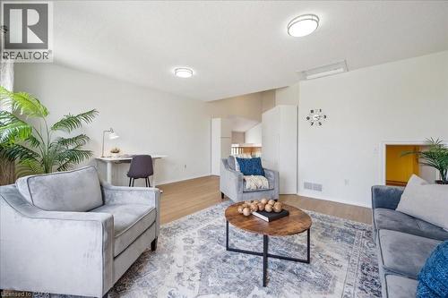 Living room with wood finished floors and baseboards - 47 Mccurdy Road, Guelph, ON 