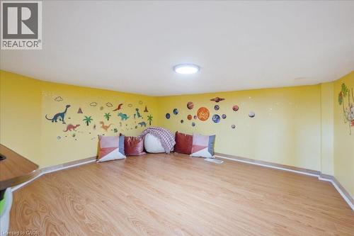 Game room featuring light wood-style floors and baseboards - 47 Mccurdy Road, Guelph, ON 