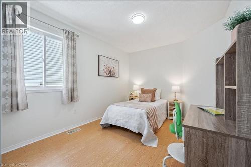 Bedroom with wood finished floors and baseboards - 47 Mccurdy Road, Guelph, ON 