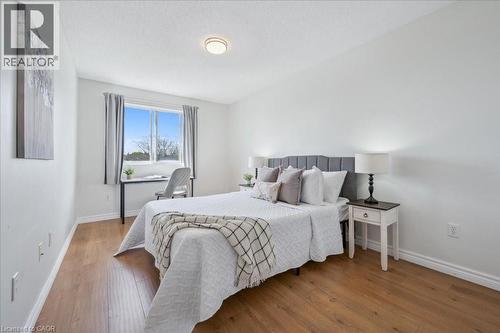 Bedroom featuring light wood-style flooring and baseboards - 47 Mccurdy Road, Guelph, ON 