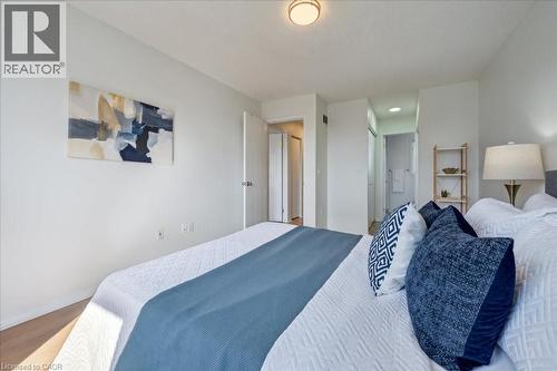 Bedroom with wood finished floors and a closet - 47 Mccurdy Road, Guelph, ON 