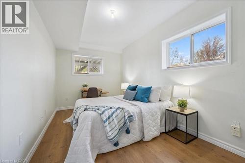 Bedroom with wood finished floors and baseboards - 47 Mccurdy Road, Guelph, ON 