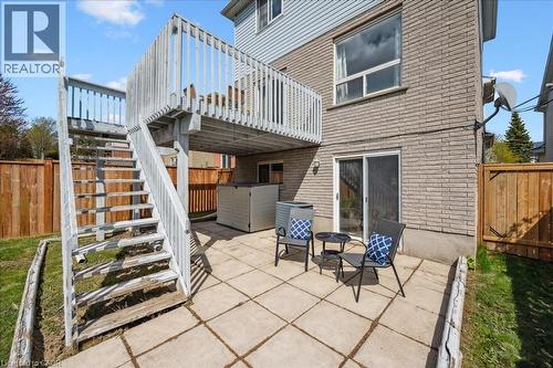 Fenced backyard featuring a patio, a wooden deck, and stairs - 47 Mccurdy Road, Guelph, ON 