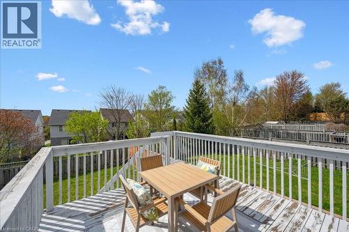 Wooden deck with outdoor dining space - 47 Mccurdy Road, Guelph, ON 