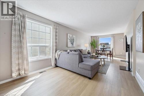 Living room featuring light wood-style floors and baseboards - 47 Mccurdy Road, Guelph, ON 