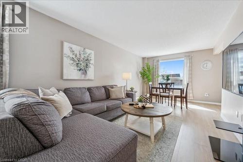 Living room featuring wood finished floors and baseboards - 47 Mccurdy Road, Guelph, ON 