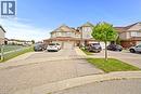 Siding exterior with brick accents, two-car garage, and paved driveway - 245 Red Clover Court, Kitchener, ON 