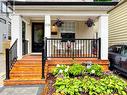 Recently refurbished front porch and lovely garden - 108 Knox Avenue, Toronto, ON 