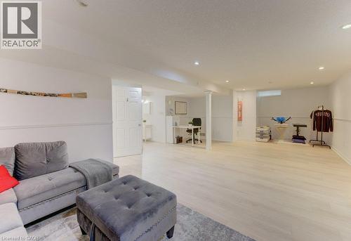 Recessed lighting illuminates wood-finish flooring - 88 Decaro Crescent, Cambridge, ON 