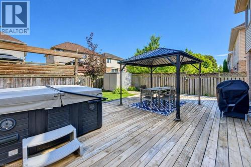 Expansive wooden deck with a built-in hot tub - 88 Decaro Crescent, Cambridge, ON 
