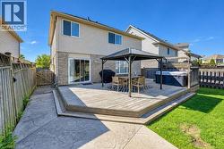 Multi-level wood deck with integrated hot tub, complete with a covered gazebo - 