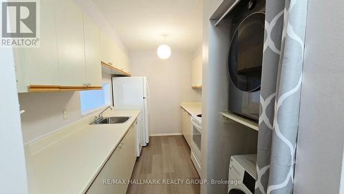 Kitchen with laundry area - 101 - 214 Viewmount Drive, Ottawa, ON 