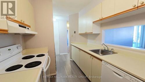 Kitchen with pass through to dining area - 101 - 214 Viewmount Drive, Ottawa, ON 