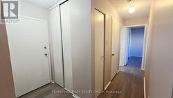 Front entrance with closet & linen closet in hall - 