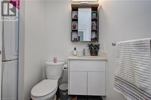 White vanity with an integrated sink and light-colored countertop - 60 Frederick Street Unit# 1213, Kitchener, ON 