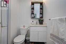 White vanity with an integrated sink and light-colored countertop - 