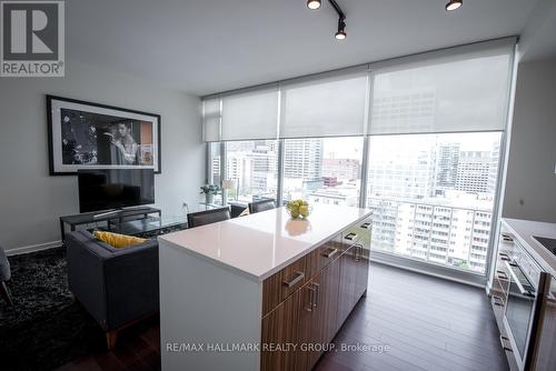 Island with Quartz Counter and Living Room - 1203 - 300 Lisgar Street, Ottawa, ON 