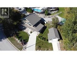 view of detached garage and driveway layout - 