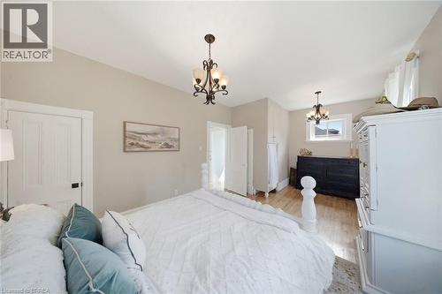 Hardwood flooring extends throughout this space featuring light-toned walls and crown molding - 62 East Avenue, Brantford, ON 