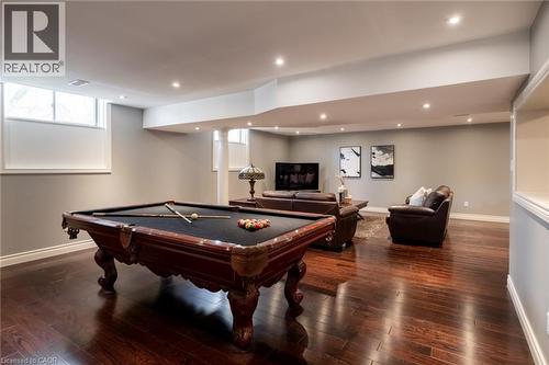 Recessed lighting, wood-finish flooring, light grey wall paint, and white trim accents - 1505 Milburough Line, Carlisle, ON 