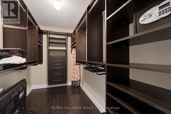 Primary bedroom walk in closet - 