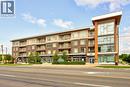 Modern multi-story building featuring a brick and panel facade - 457 Plains Road Unit# 225, Burlington, ON 