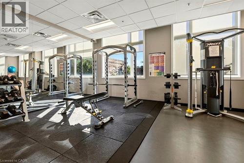 Dedicated fitness center featuring rubber flooring and mirrored walls - 457 Plains Road Unit# 225, Burlington, ON 