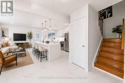 Virtually staged open concept kitchen /family RM - 34 Cathcart Crescent, Brampton, ON 