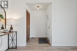 Lovely updated steel front door welcomes you home! Bright entry features NEW vinyl flooring, NEW light fixture & opens to spacious living room. - 